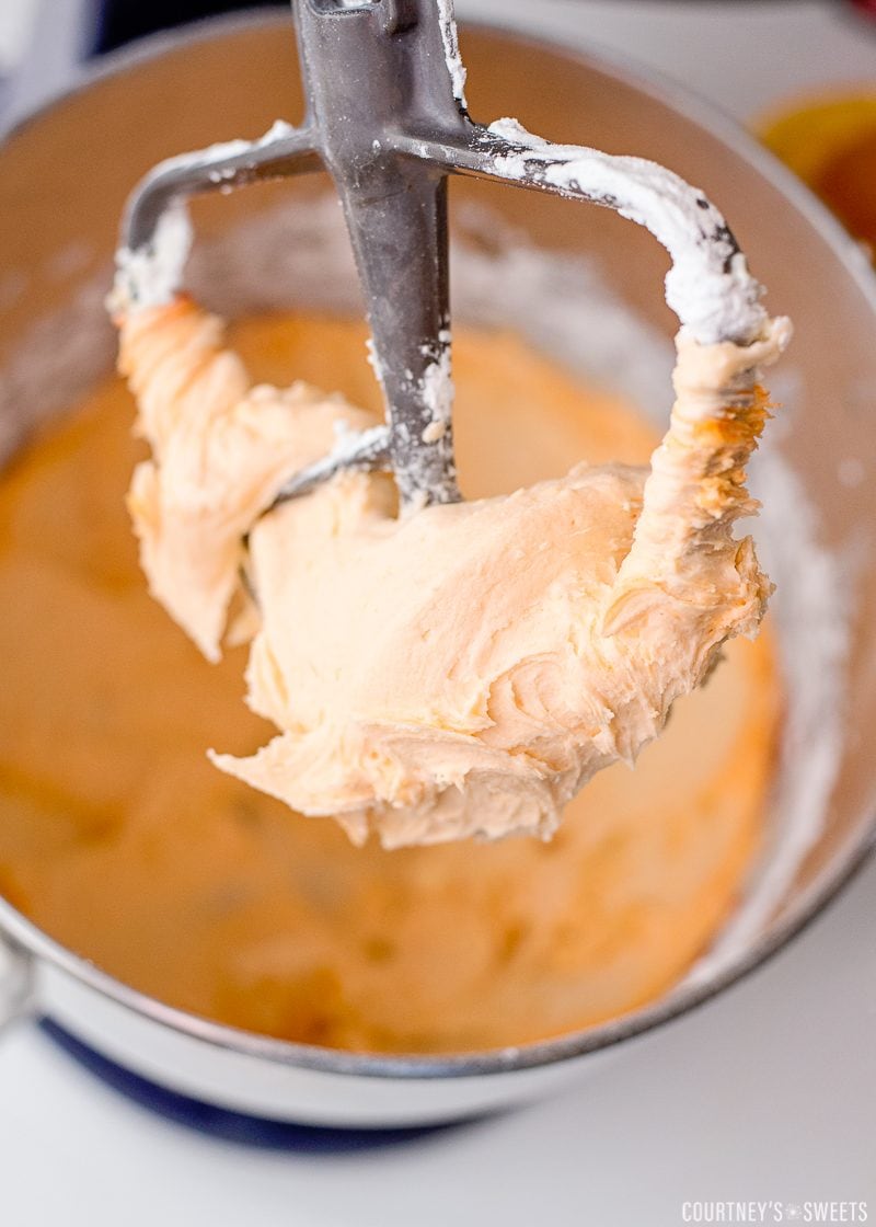orange buttercream frosting in stand mixer
