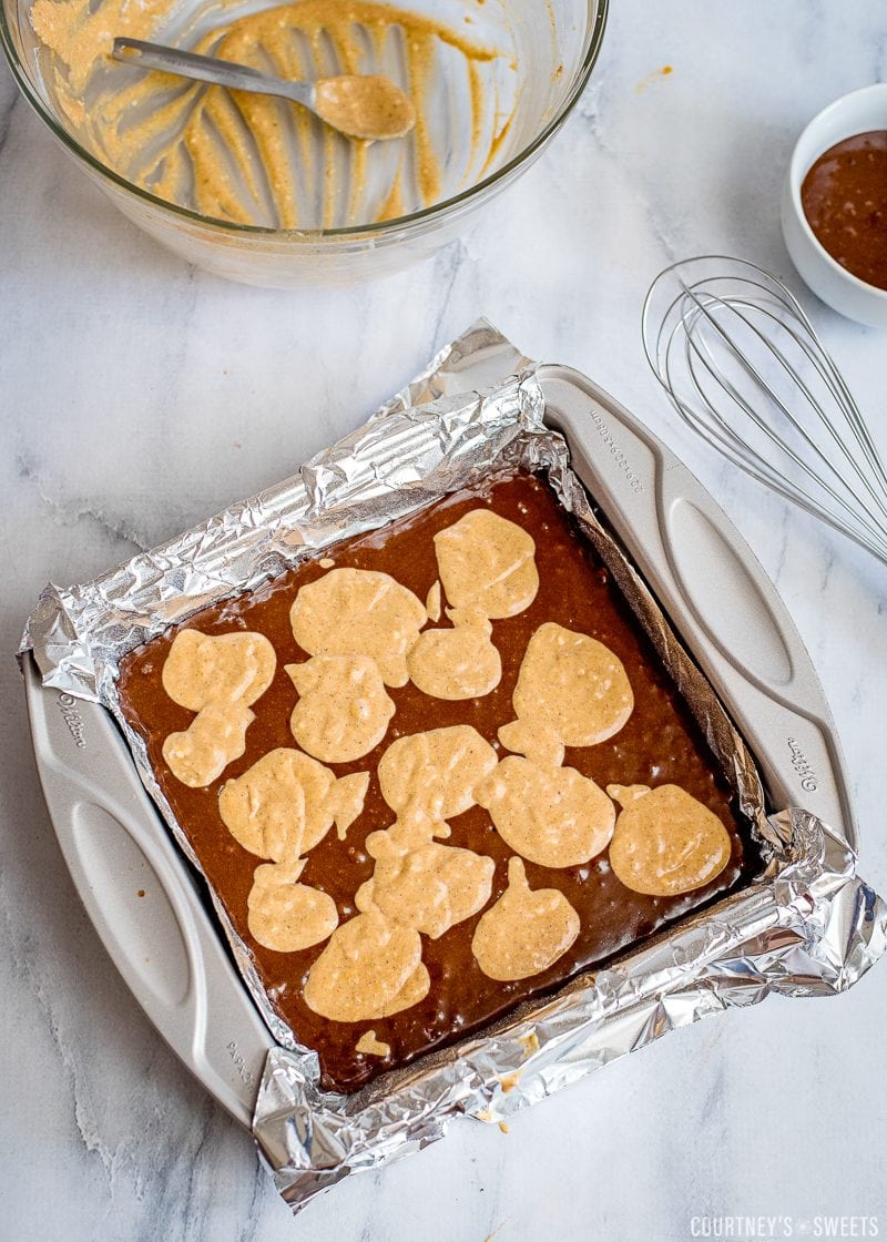 brownie and pumpkin batter in a baking dish