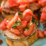 pork loin bruschetta toast appetizer on a plate