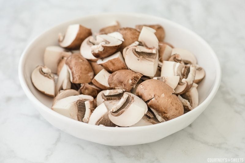 raw mushrooms in a white bowl