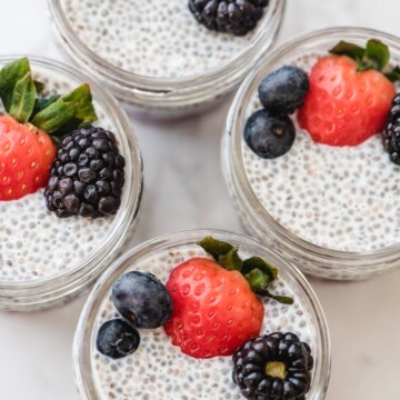 chia seed pudding with berries in meal prep jars
