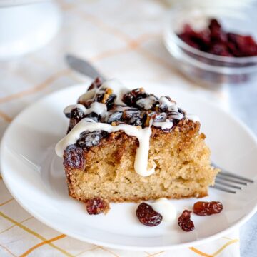 slice of cranberry upside down cake on a white plate