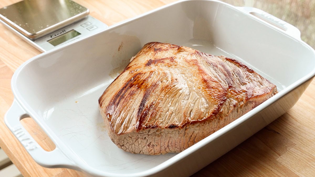 seared brisket in a casserole dish.