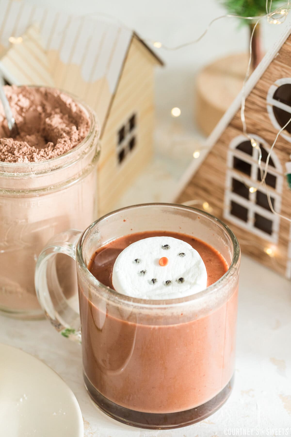 snowman marshmallow in a glass of hot chocolate with cocoa
