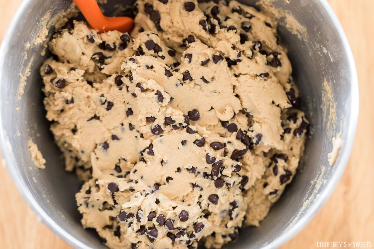 raw chocolate chip cookie dough in mixer bowl