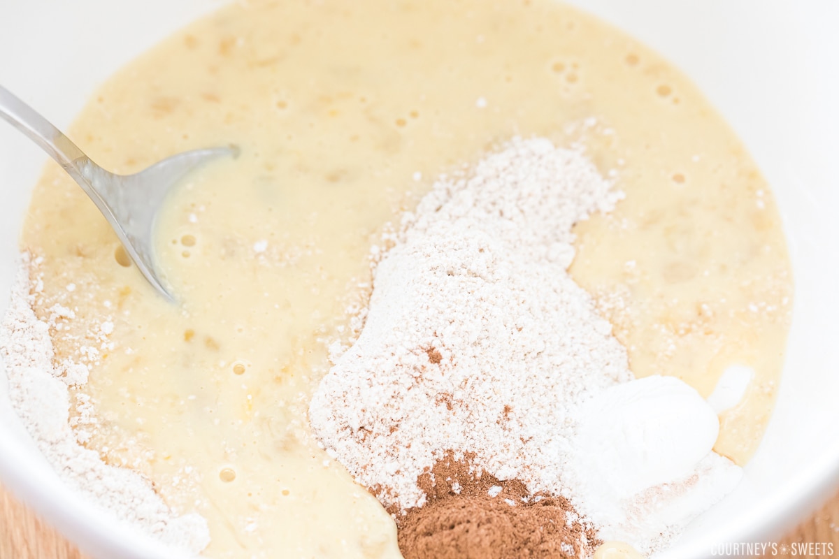 mixing wet and dry ingredients in a bowl.