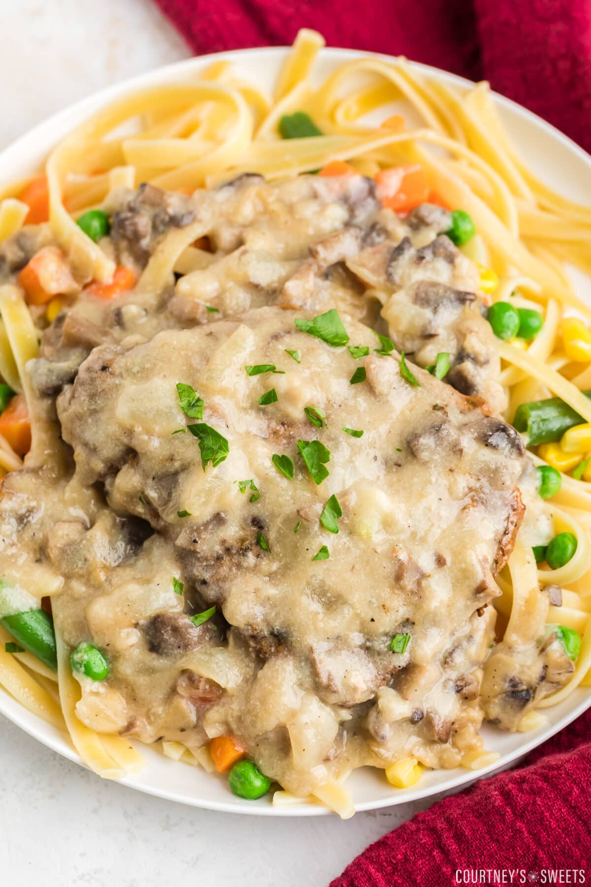 pork chop smothered with cream of mushroom soup over pasta.