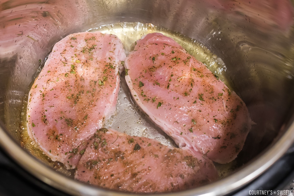 raw pork chops seasoned inside instant pot