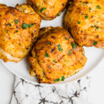 air fryer chicken thighs on a white plate