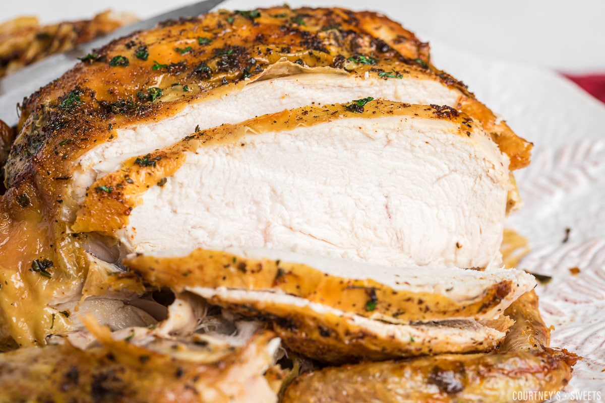 close up of air fryer chicken with breast sliced.