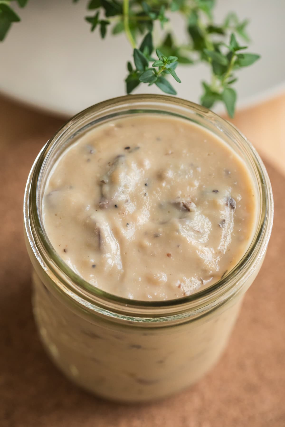 Overhead view of from-scratch condensed cream of mushroom soup in a mason jar.