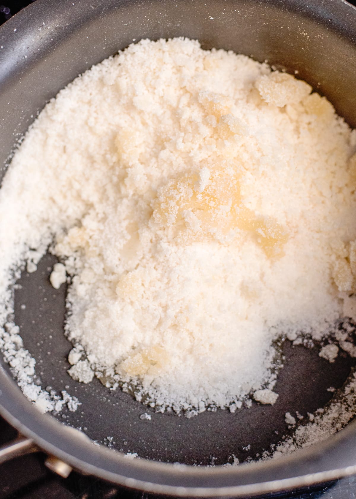 sugar browning in a saucepan for caramel sauce.