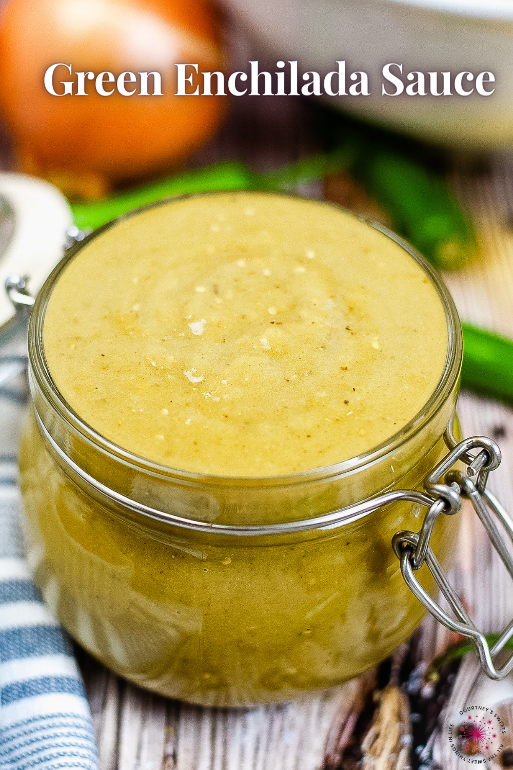 green enchilada sauce in a glass jar with text for pinterest.