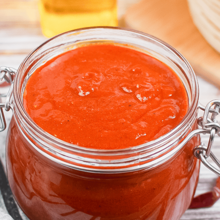 red enchilada sauce in a glass jar.