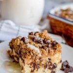 chocolate chip coffee cake slice on a white plate.