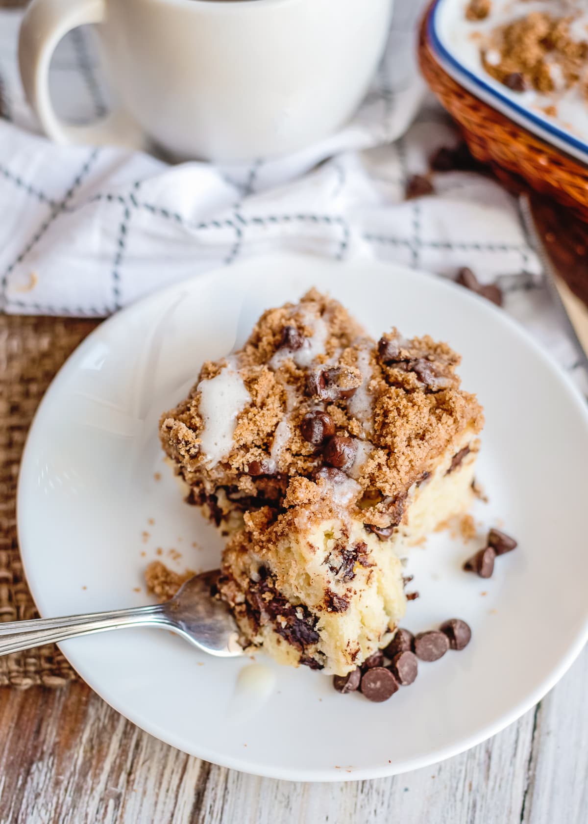 chocolate chip coffee cake on a plate with a fork.
