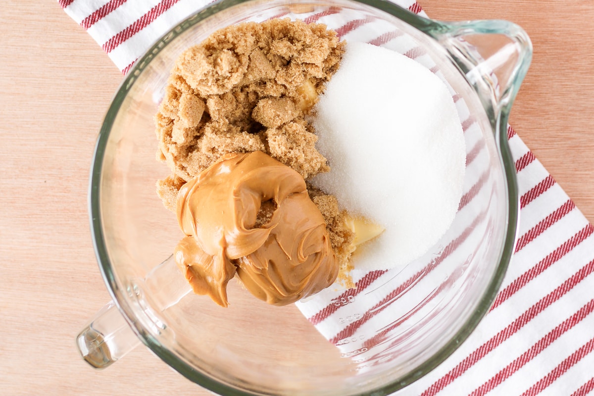 peanut butter, brown sugar, granulated sugar, and butter in a stand mixer bowl.