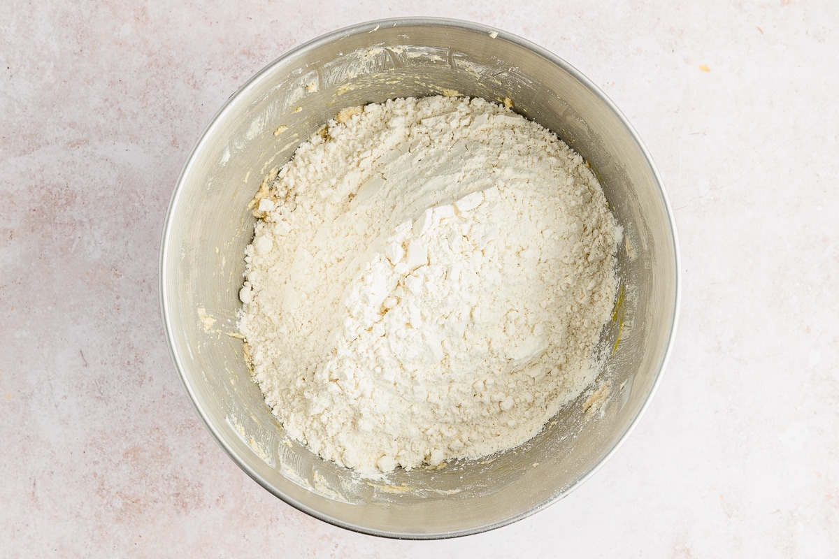 adding dry mix to wet mix to make cookie dough.