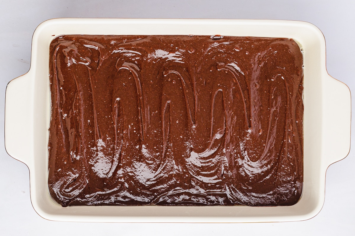 brownie batter in a baking dish.