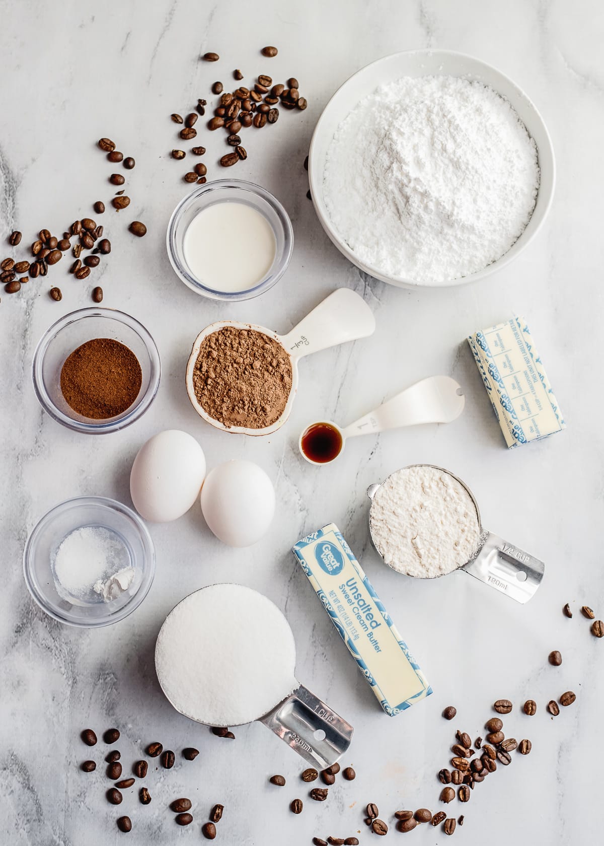 ingredients for brownies and frosting flat lay photo.
