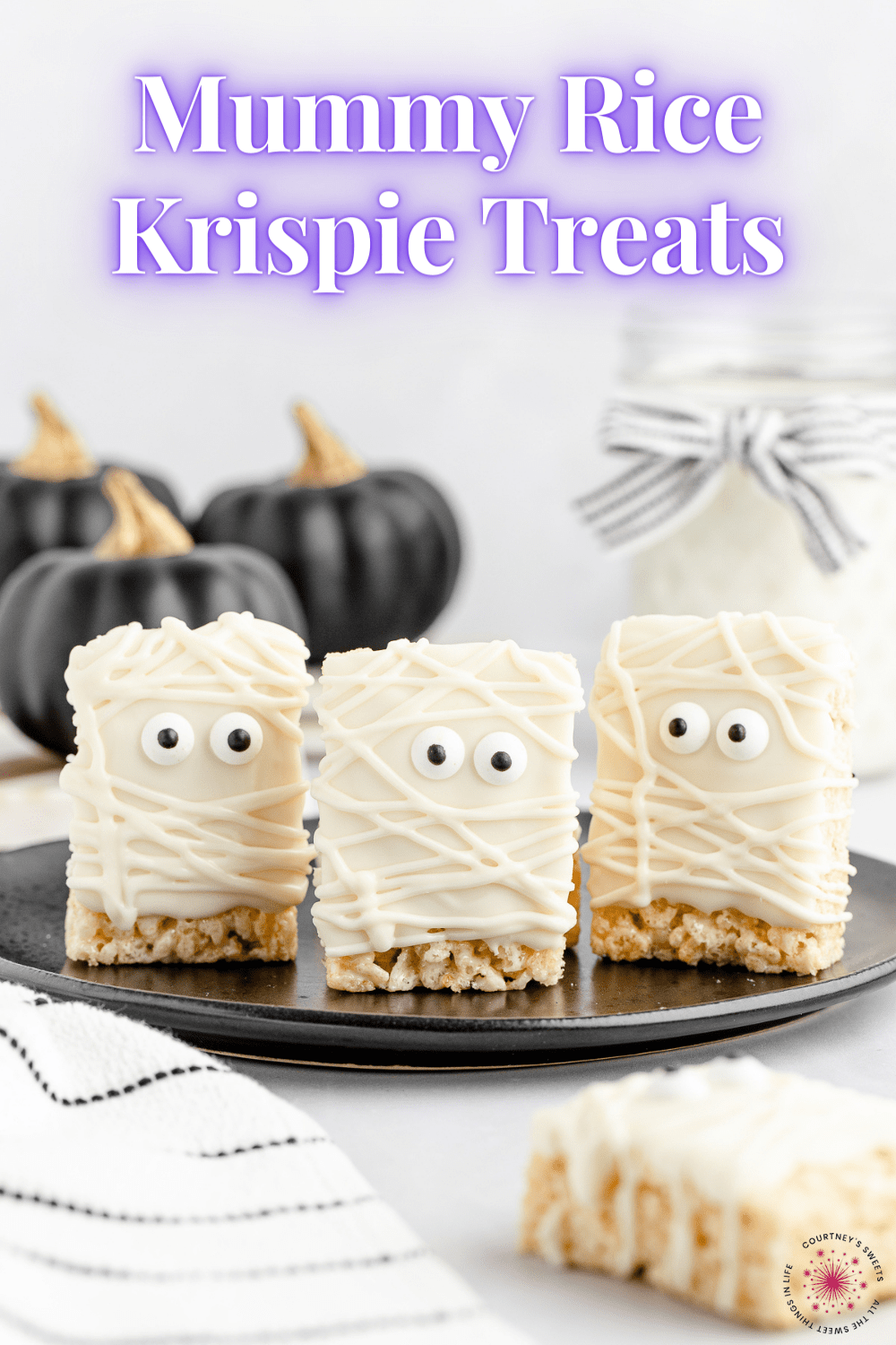 mummy rice krispie treats on a black plate with one on the backdrop below the plate with text on image for pinterest.