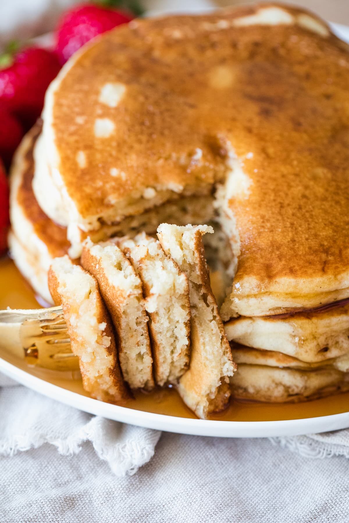 a fork full bite of dairy free pancakes.