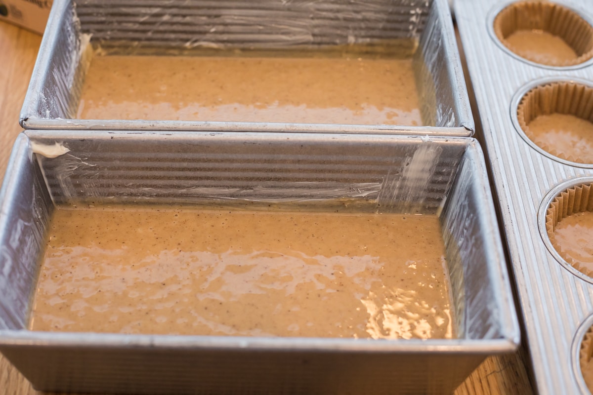 honey cake batter in two loaf pans.