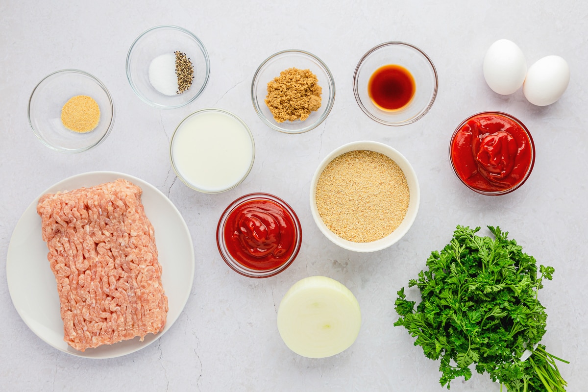 ground chicken, bread crumbs, milk, onion, parsley, ketchup, Worcestershire sauce, salt and pepper, brown sugar, all in containers overlay photo showing ingredients.