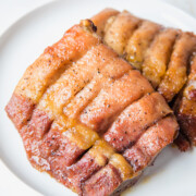 boneless pork ribs on a white plate.