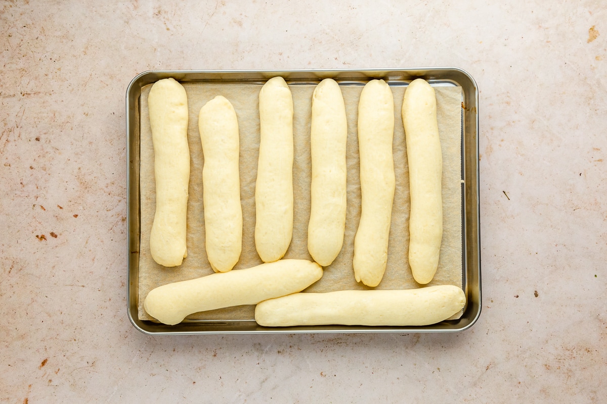 parbaked breadsticks on a baking sheet.