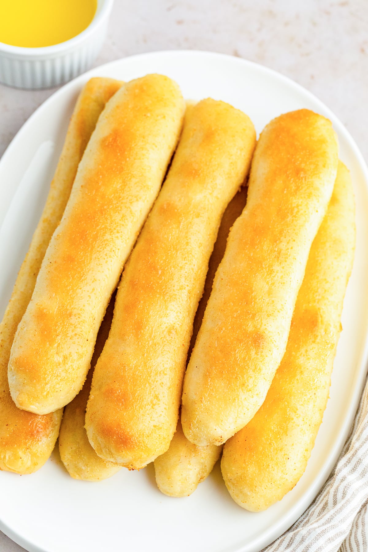 copycat olive garden breadsticks on a white plate.