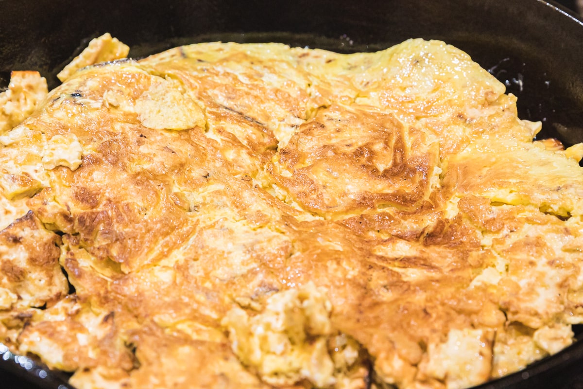 flipped matzo brei in a skillet.