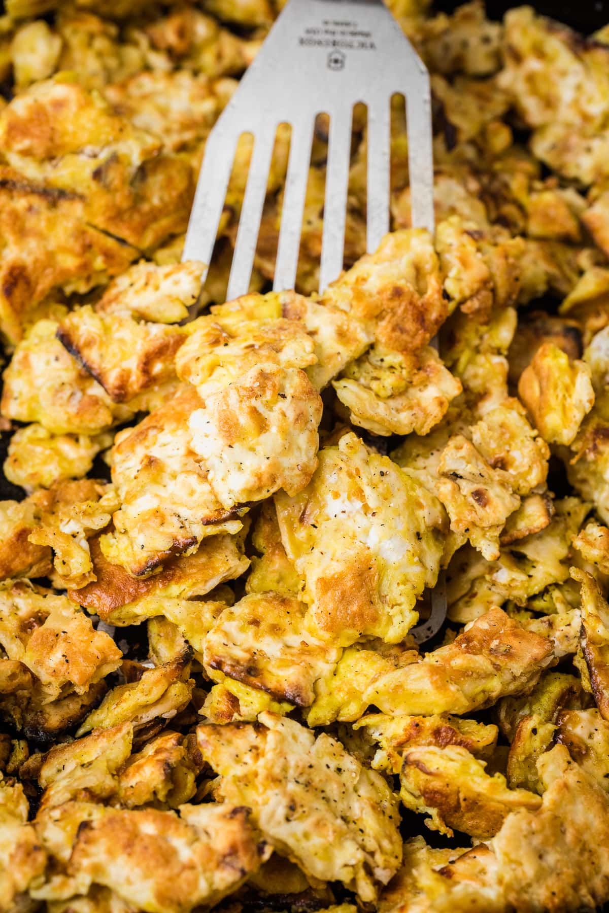 crispy matzo brei in a cast iron skillet.