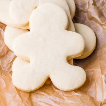 cut out sugar cookies on parchment paper.