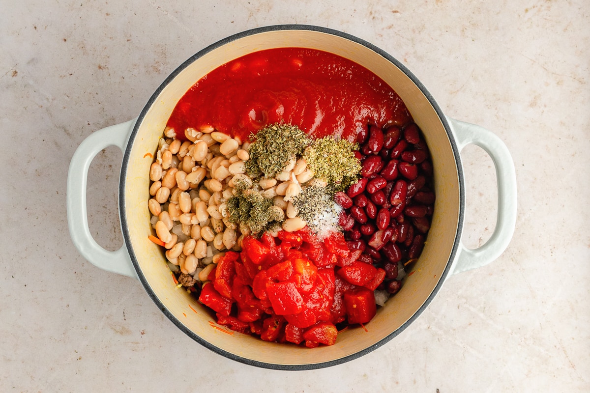 overhead photo of ingredients for soup in a pot.