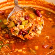 ladle full of Pasta e Fagioli Soup.