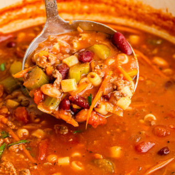 ladle full of Pasta e Fagioli Soup.
