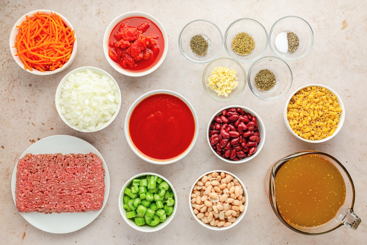 overhead photo of ingredients in individual bowls for Pasta e Fagioli Soup.