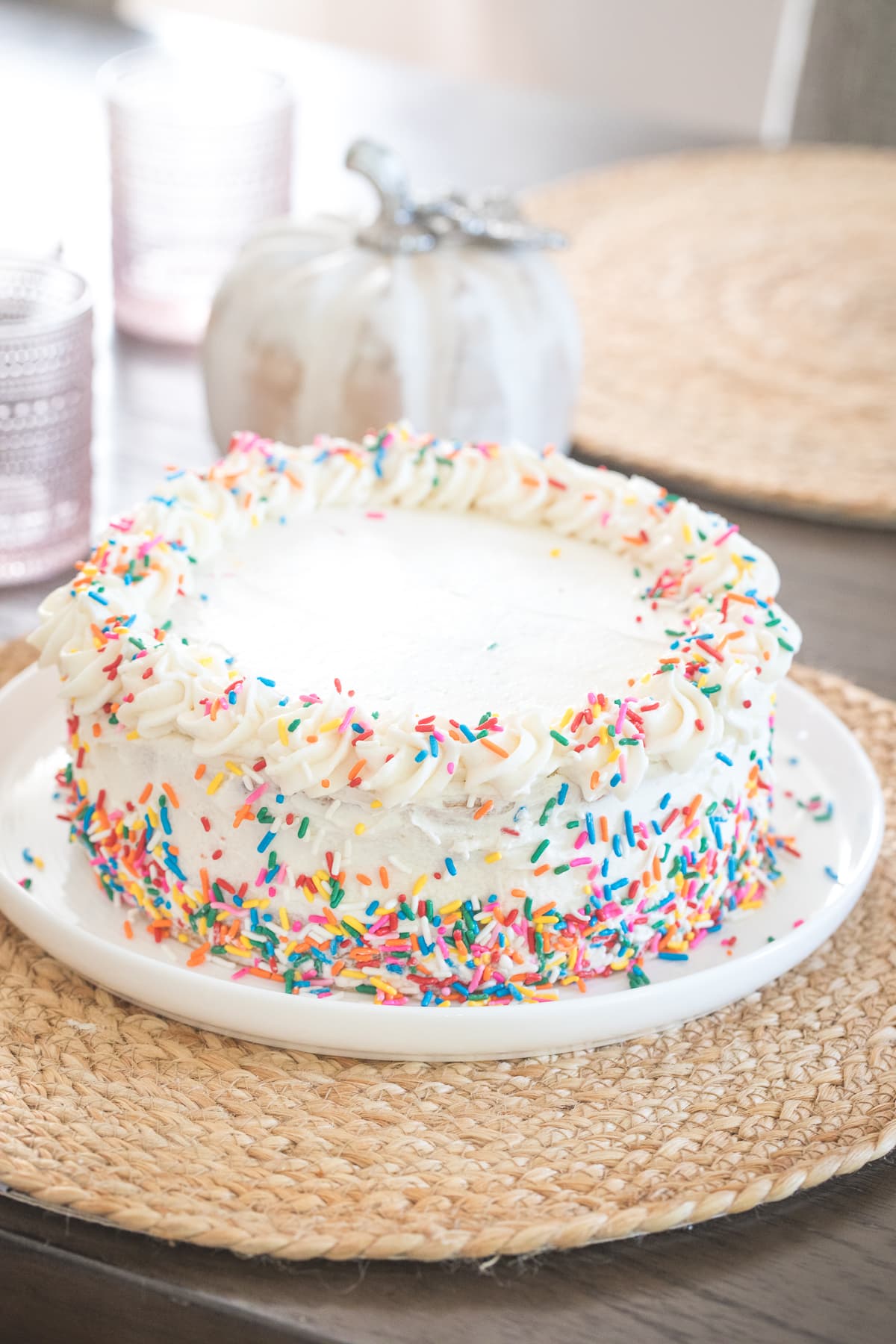 confetti cake with sprinkles on a table.