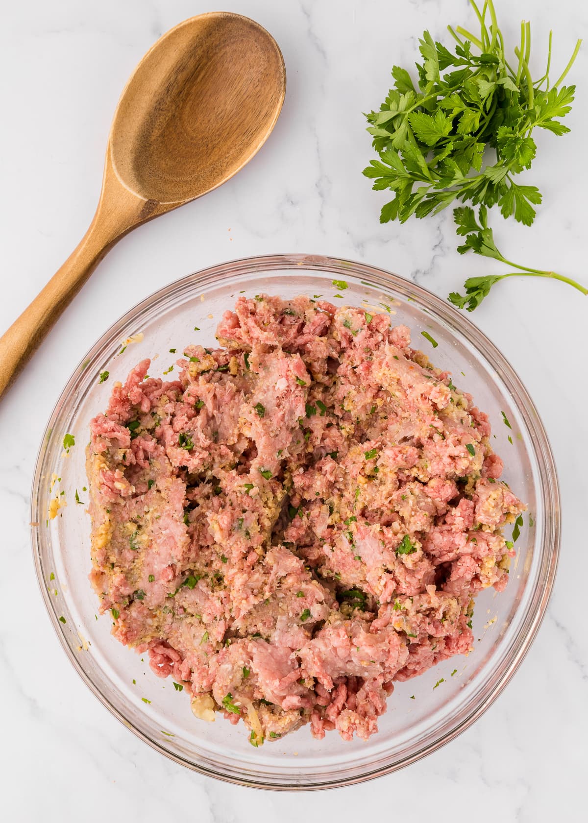 meatball mixture in glass bowl.
