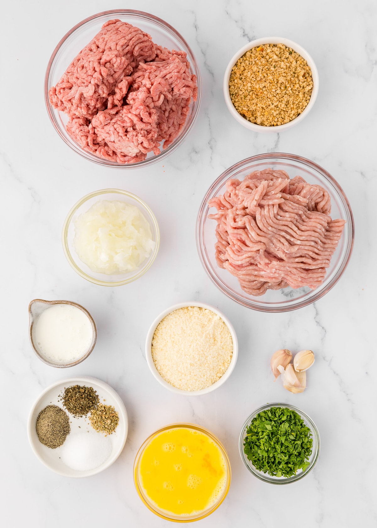 ingredients in bowls for meatballs.