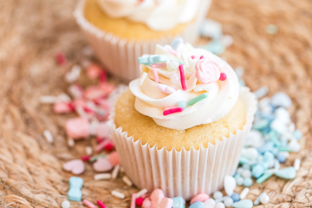 decorated gender cupcakes with pink and blue sprinkles.