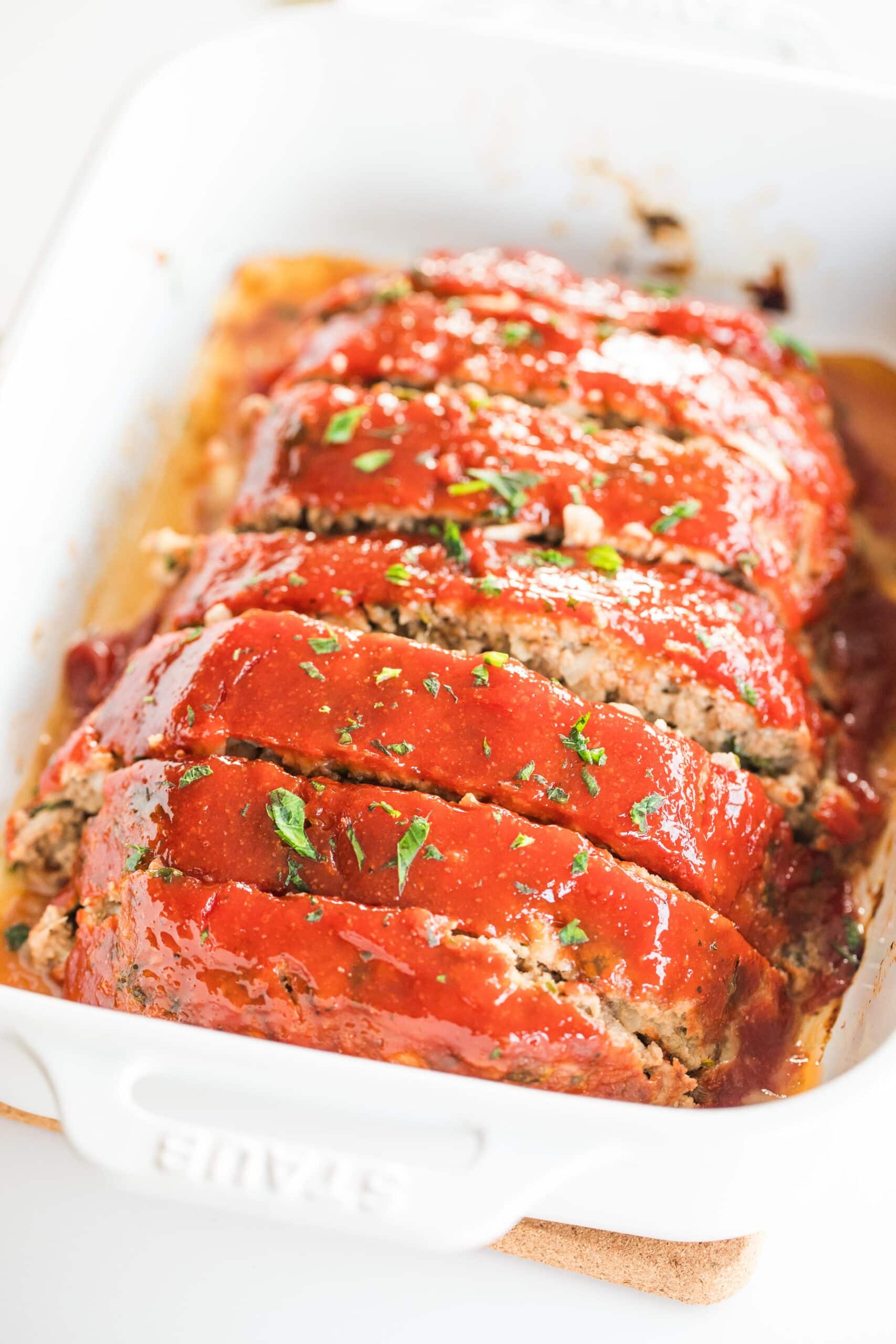 sliced meatloaf in a casserole dish.