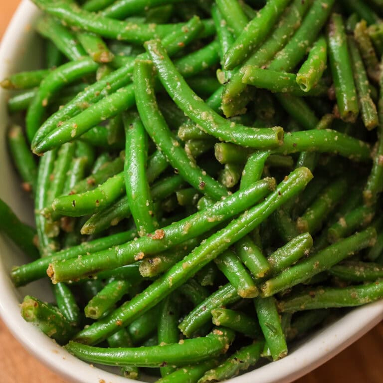 Garlic green beans cooked from frozen green beans in a white bowl.