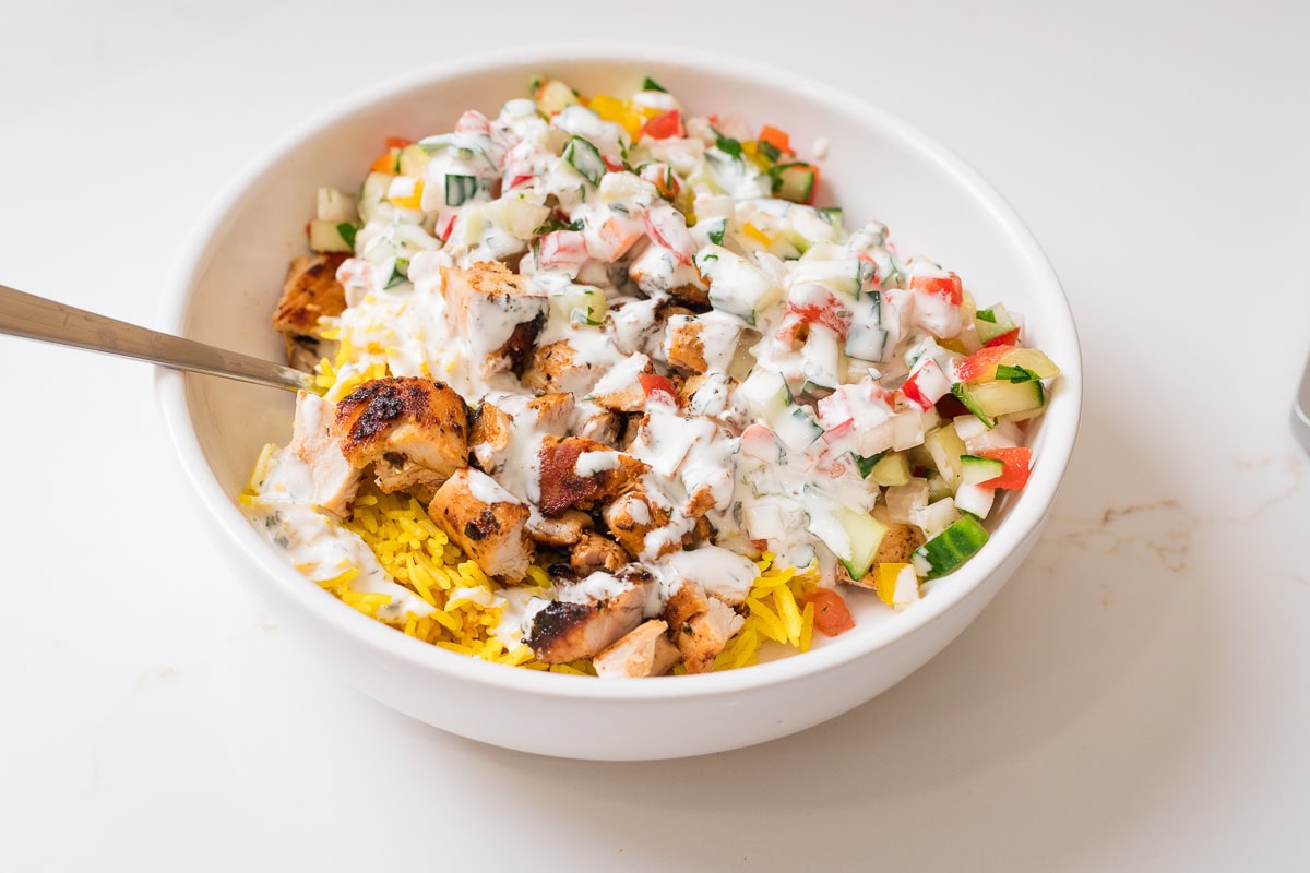 halal cart chicken in white bowl.