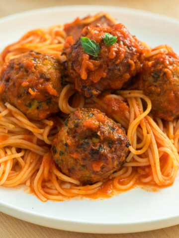 baked chicken meatballs with spaghetti.