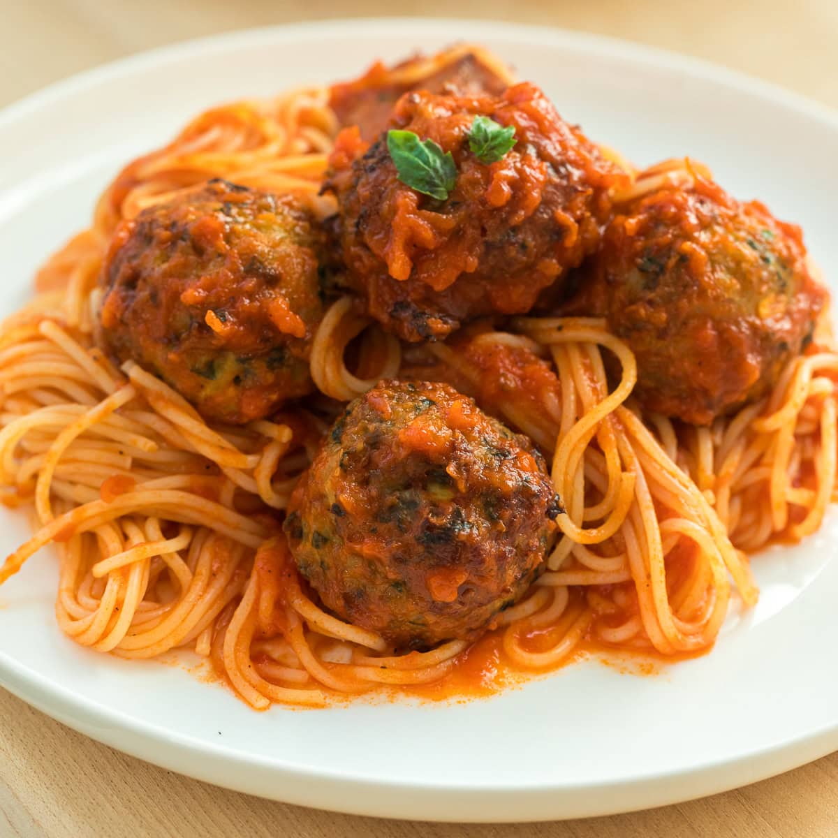 baked chicken meatballs with spaghetti.