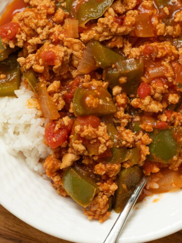 Unstuffed Peppers with Ground Chicken in a bowl with a spoon over rice.