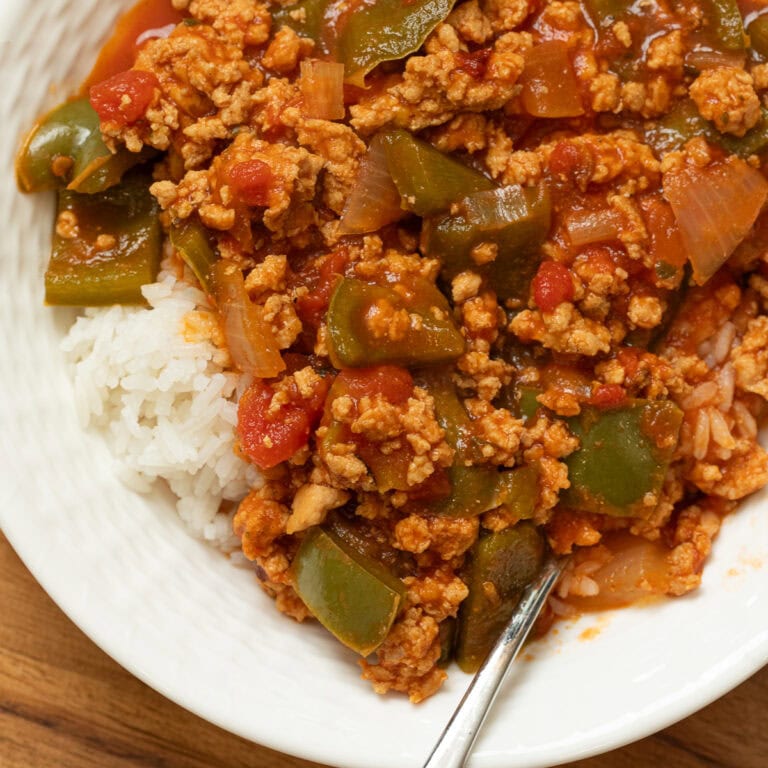 Unstuffed Peppers with Ground Chicken in a bowl with a spoon over rice.
