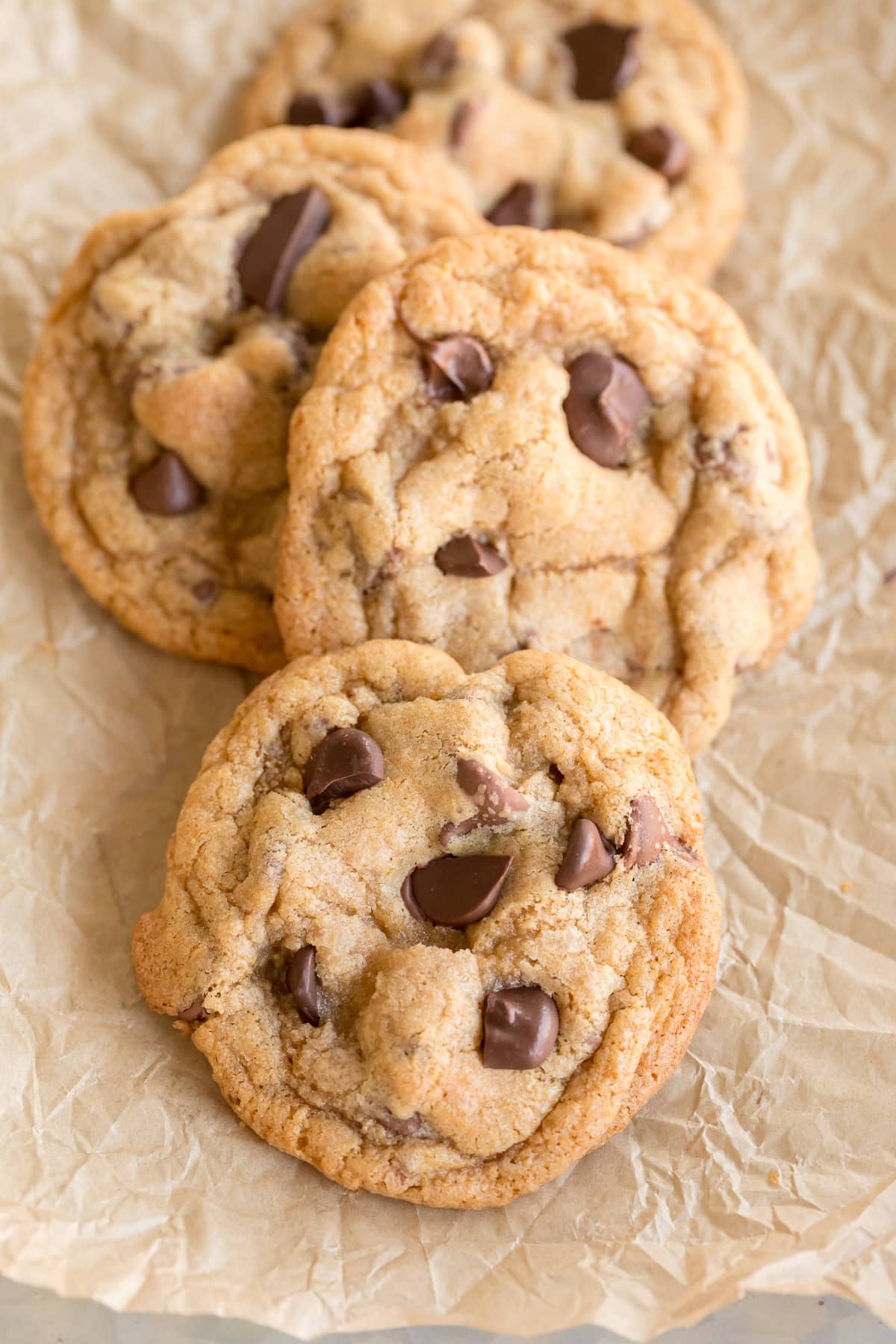 Cookies on a piece of crinkled parchment paper.